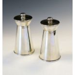 Pair of Elizabeth II silver pepper grinders, each of conical design with flared top, Birmingham