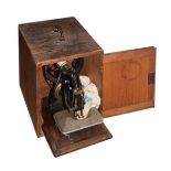 Vintage Willcox & Gibbs C-Frame sewing machine in the original pine case