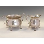 Edward VII silver cream jug and two-handled sugar basin, each of pot bellied Georgian design,