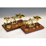 Two sets of brass and mahogany postal scales, plus two small boxes of weights