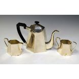 White metal three piece tea set, the bases stamped 'Silver', teapot 17cm high