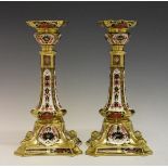 Pair of Royal Crown Derby candlesticks, decorated in the Imari palette, printed marks and date