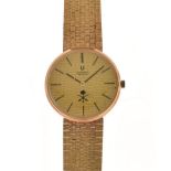 Universal Genève, - Gentleman's 18K 0.750 manual wind wristwatch, the signed textured gold dial