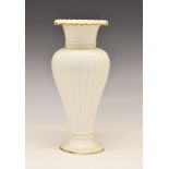 Royal Copenhagen baluster shaped vase, having a flared neck, fluted decoration and standing on a