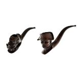 Two carved figural pipes, by Newman, the first formed as a bearded man, the second as Napoleon