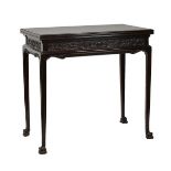Early 20th Century carved mahogany rectangular fold-over card table, having a finely carved