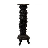 Oriental carved hardwood vase stand, early 20th Century, the circular top with studded border and