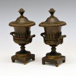 Pair of 19th Century French bronze cassoulets, each of urn form having two handles, reversible cover