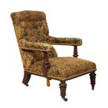 Victorian mahogany Campaign-style chair, the deep buttoned back and over stuffed arms on turned