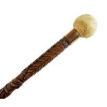 19th Century carved walking stick, decorated with thistles and shamrock, carved ivory pommel handle,
