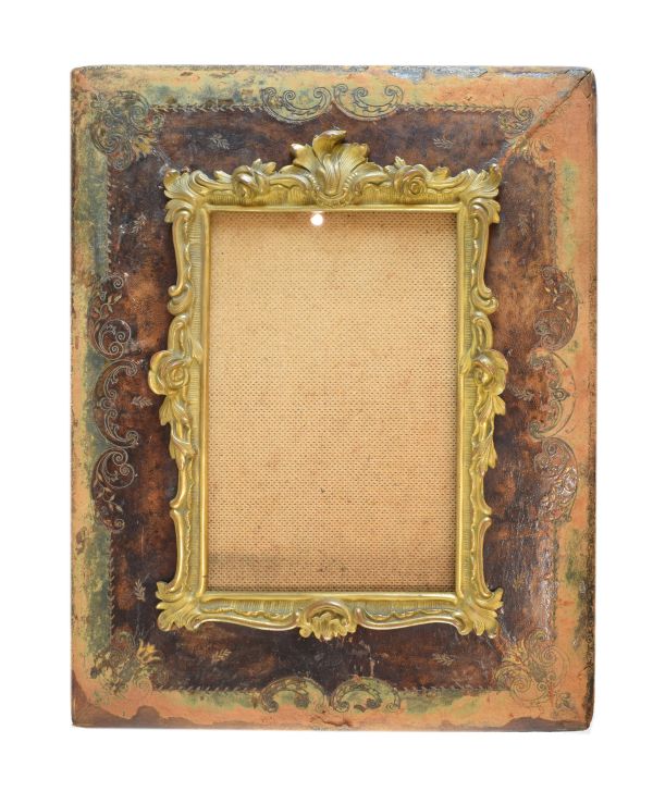 Late 19th Century ormolu and tooled leather picture frame, the ormolu inner decorated with cast