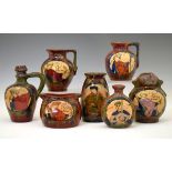 Group of seven pieces of Louis Etienne Desmant faience pottery, each typically decorated with scenes