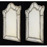 Pair of 20th Century Italian (probably Venetian) wall mirrors, each having arched shallow-bevelled