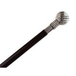 Walking stick, the white metal pommel handle having embossed wrythened decoration and stamped .