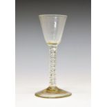 18th Century wine glass, having a bucket bowl and standing on a double series air twist stem and