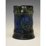 Elton Ware ewer, of waisted cylindrical form having typical stylised foliate decoration on a blue/