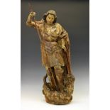 Carved giltwood and polychrome decorated figure of St Michael, probably 16th Century Spanish,