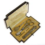 Early 20th Century French silver gilt sewing etui, comprising needle case, needle threader,