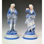 Pair of late 19th Century French porcelain figures, depicting a young gallant and lady, each holding