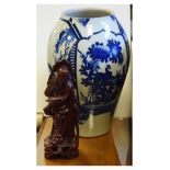 Large Oriental blue and white vase, 47cm high and a carved oriental figure 36cm high