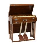 Mid 20th Century oak cased 'Pearl River' travelling harmonium having chromed mounts, having