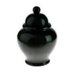 Small Chinese dark green jade baluster shaped vase, having a domed cover, 8cm high