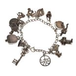 White metal curb link charm bracelet set sixteen assorted charms, 1.4toz approx