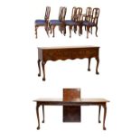 Old reproduction George I-style figured yew-wood dining suite of wind-out extending dining table,