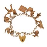 Yellow metal curb-link charm bracelet with 9ct gold padlock, and ten assorted gold and yellow