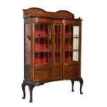 Early 20th Century inlaid mahogany display cabinet of serpentine-fronted design with double arched