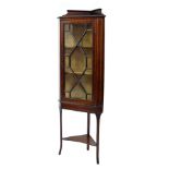 Early 20th Century inlaid mahogany corner cabinet on stand, with astragal-glazed door enclosing silk