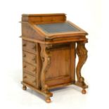 Victorian-style walnut davenport with hinged superstructure and sloping fall over four drawers on