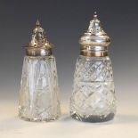 Two George V silver and cut glass sugar casters, London 1925, 1.1toz approx weighable silver