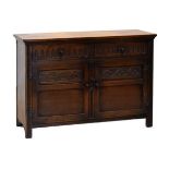 Jaycee oak dresser base fitted two short drawers over two carved panelled doors, 122cm wide