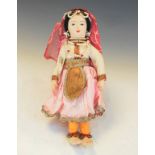 Vintage fabric doll of an Indian woman wearing a veil and embroidered dress, measures