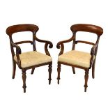 Pair of 19th Century mahogany bar back, scroll arm elbow chairs