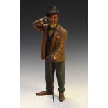 Painted plaster figure of a gentleman with monocle and top hat, 33cm high