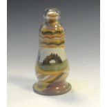 Coloured sand and glass ornament depicting a sea arch, 15cm high