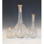 Two German decanters with cut crystal bases and silver collars, stamped 800, height of decanters