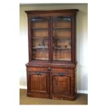 Victorian mahogany two section bookcase, the upper fitted three adjustable shelves enclosed by a