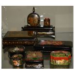 Group of 20th Century Russian black-lacquered papier-mâché boxes to include a desk stand (7)