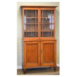 19th Century mahogany two section bookcase, the upper fitted two adjustable shelves enclosed by a