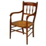 Early 20th Century beech framed open arm elbow chair having rush seat