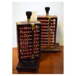 Pair of modern Oriental lamp bases, each formed as an abacus