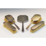 George V five piece silver backed dressing table set comprising: four brushes and one mirror,