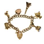 9ct gold curb-linked charm bracelet set six various gold and yellow metal charms plus a heart shaped