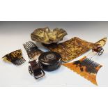 Group of antique tortoiseshell items to include bowl, circular pot, model carriages, combs,
