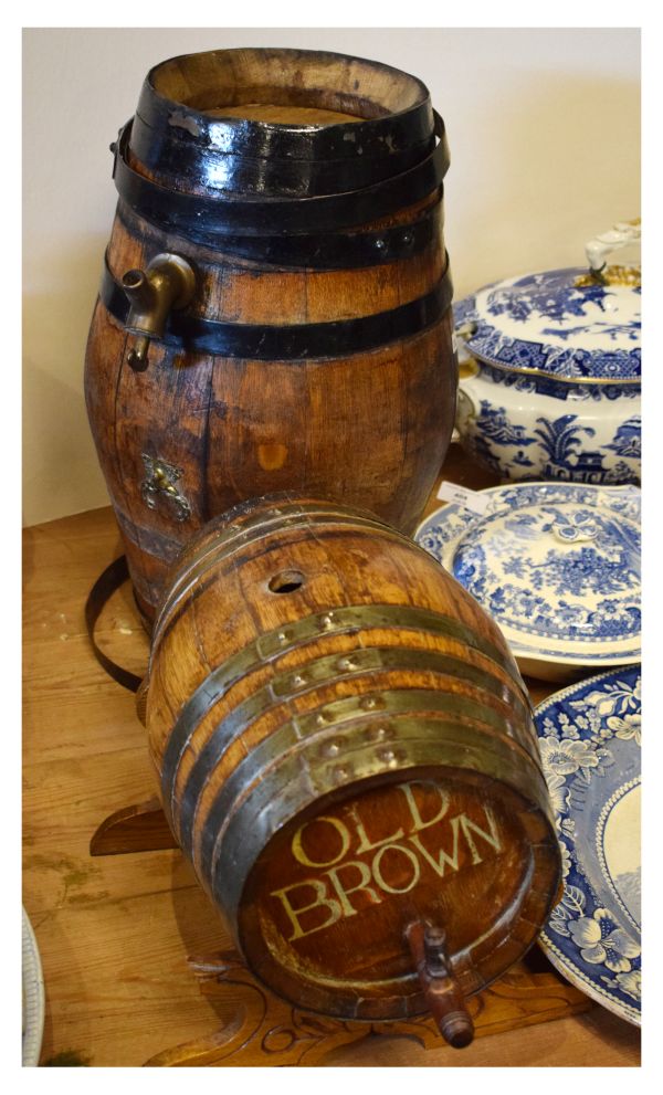 Two metal-bound coopered oak barrels, one advertising 'Old Brown', the larger 44cm high (2)