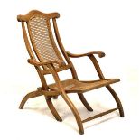 Late 19th/early 20th Century folding beech framed cane seat steamer chair