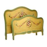Continental painted bed, the headboard having floral swag decoration (head, footboard and side